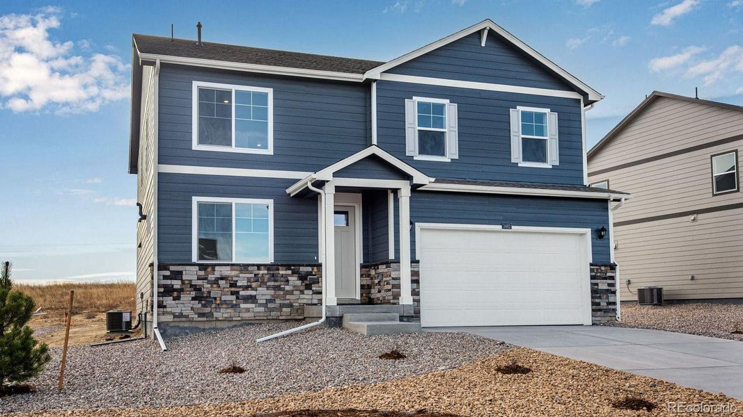 Front exterior of a new home in Spring Valley Ranch, Elizabeth, CO, highlighting curb appeal (Image 28).