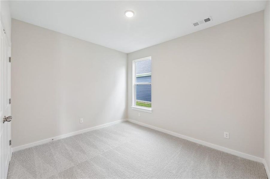 Spacious, unfurnished interior of a new home in The Park at Brighton, Locust Grove (Image 15).