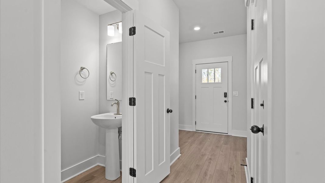 First-class entryway featuring hardwood floors and accomplished architectural style