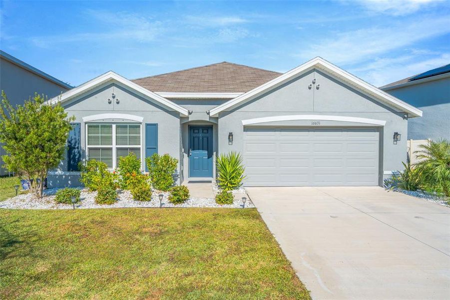 Front exterior of a new home in Sereno, Wimauma, FL, highlighting curb appeal (Image 25).