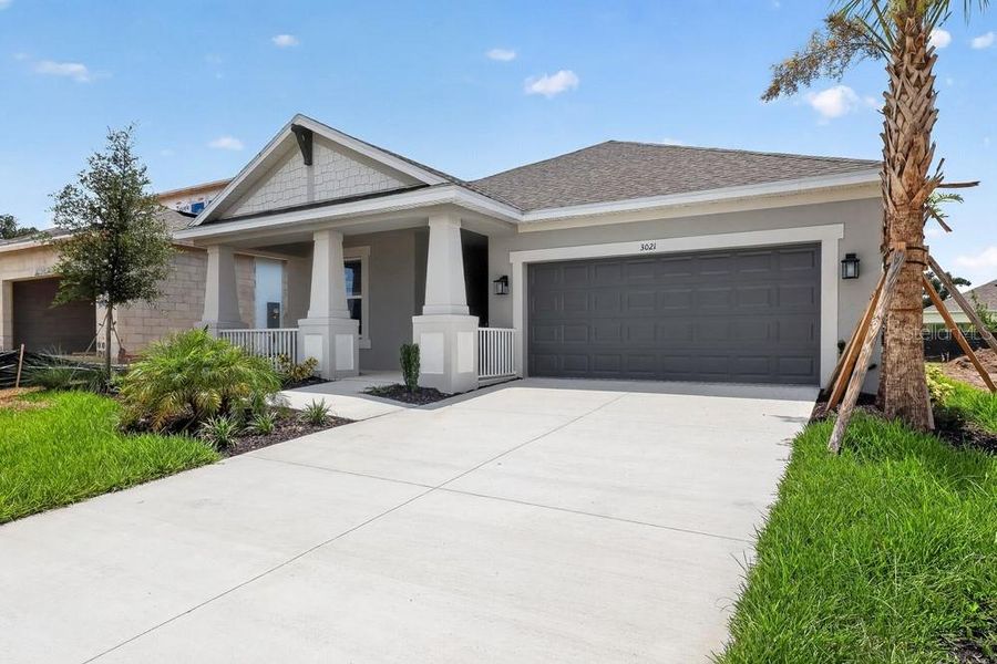 Front exterior of a new home in Timber Ridge, Plant City, FL, highlighting curb appeal (Image 1). Front exterior of a new home in Timber Ridge, Plant City, FL, highlighting curb appeal (Image 1).