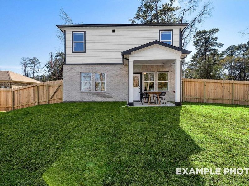 Exterior details and patio area of a home in Windmill Estates, Magnolia (Image 1).