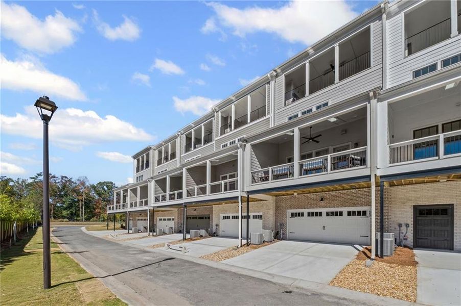 Front exterior of a new home in South on Main, Woodstock, GA, highlighting curb appeal (Image 23).