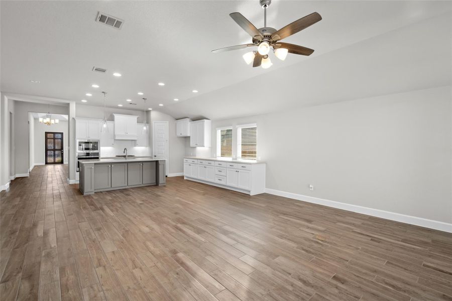 Expansive view of the Great Room, showcasing the complete Open-Concept flow between the Kitchen and Living Area.