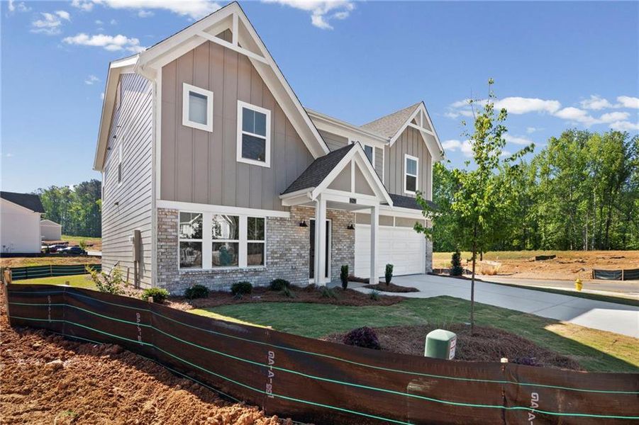 Front exterior of a new home in Sage Woods, Dallas, GA, highlighting curb appeal (Image 18).