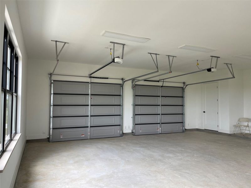 Garage featuring a garage door opener