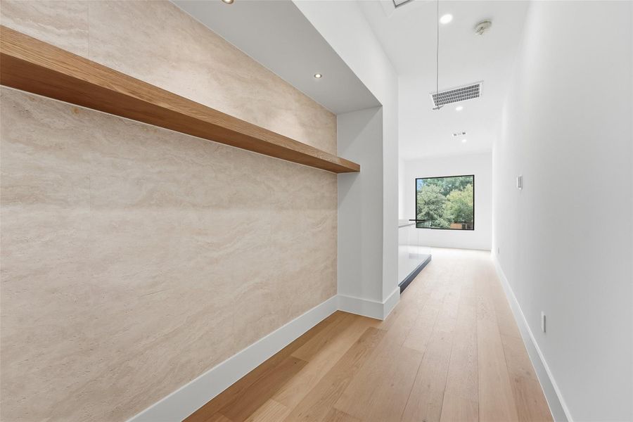 A decorative upstairs niche offers flexible space for a homework station, or display area