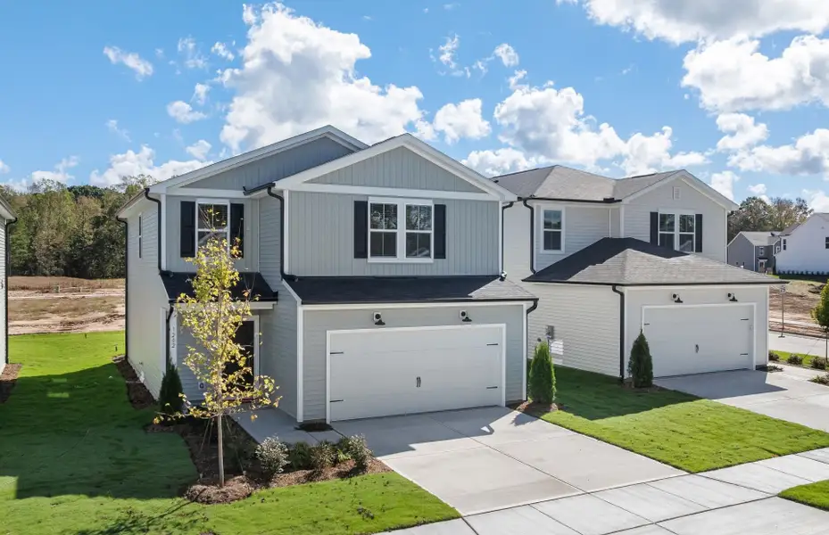 Front exterior of a new home in Carpenter Falls, Durham, NC, highlighting curb appeal (Image 1). Front exterior of a new home in Carpenter Falls, Durham, NC, highlighting curb appeal (Image 1).