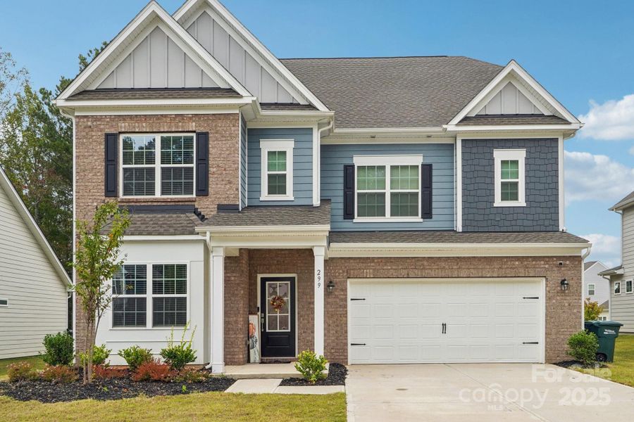 Front exterior of a new home in Falls Cove at Lake Norman: Falls Cove at Lake Norman - Phase 3 & 4, Troutman, NC, highlighting curb appeal (Image 1).