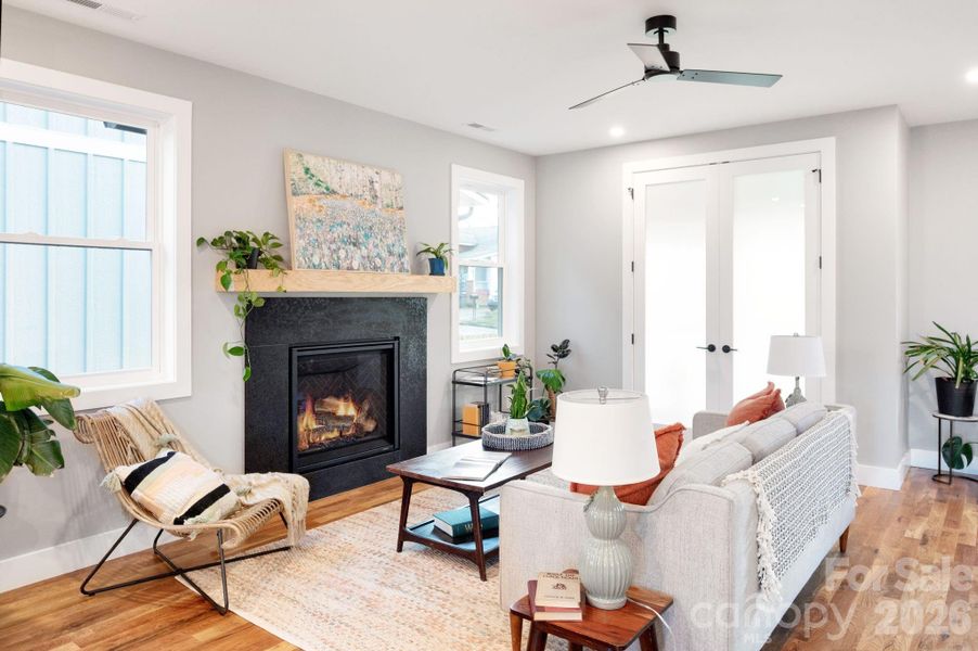 Granite Tile-Surround Gas Fireplace and Floating Mantel