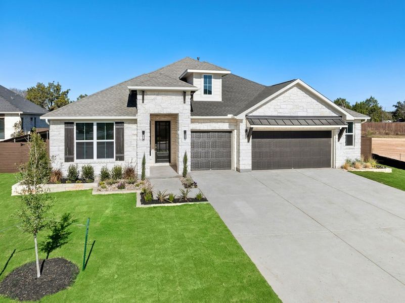 Front exterior of a new home in Riverstone, Georgetown, TX, highlighting curb appeal (Image 1). Front exterior of a new home in Riverstone, Georgetown, TX, highlighting curb appeal (Image 1).