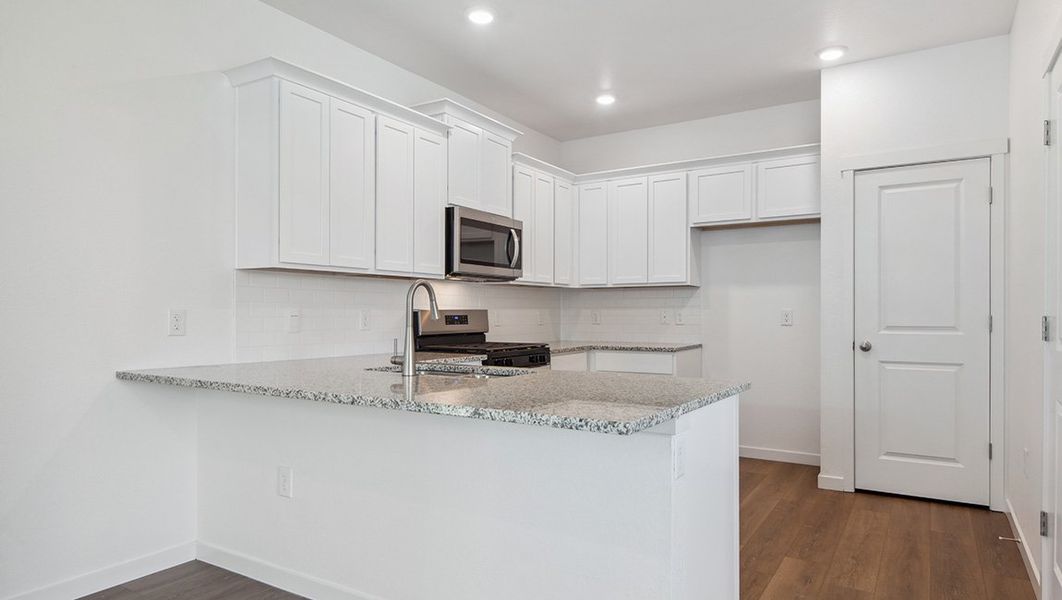 Representative furnished interior of a home built from the DOUGLAS by D.R. Horton in Horizon Uptown, Aurora (Image 5).