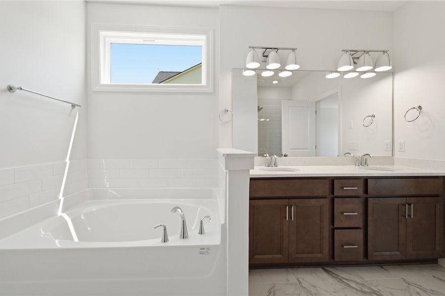 Furnished interior view inside a new home in Aden Woods, Fairview (Image 12).