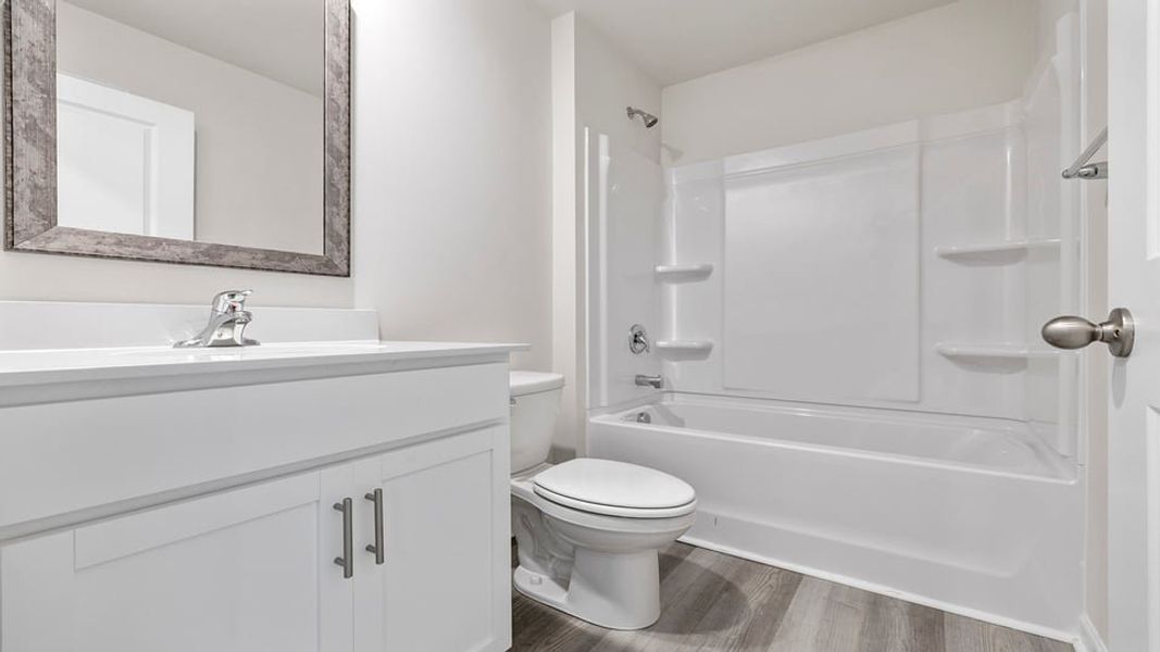 Furnished interior view inside a new home in Bentley Park, Greenwood (Image 4).