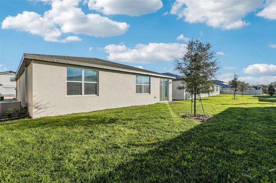 Exterior details and patio area of a home in Lawson Dunes - Signature Series, Haines City (Image 2). Exterior details and patio area of a home in Lawson Dunes - Signature Series, Haines City (Image 2).