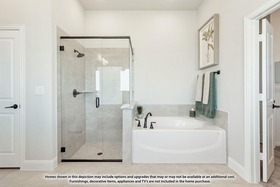 Master bathroom with glass walk-in shower, soaking tub, and gray tile surround Master bathroom with glass walk-in shower, soaking tub, and gray tile surround