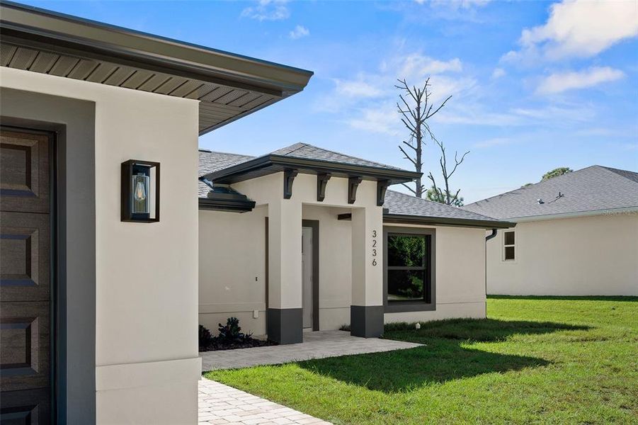Exterior details and patio area of a home in , North Port (Image 26).