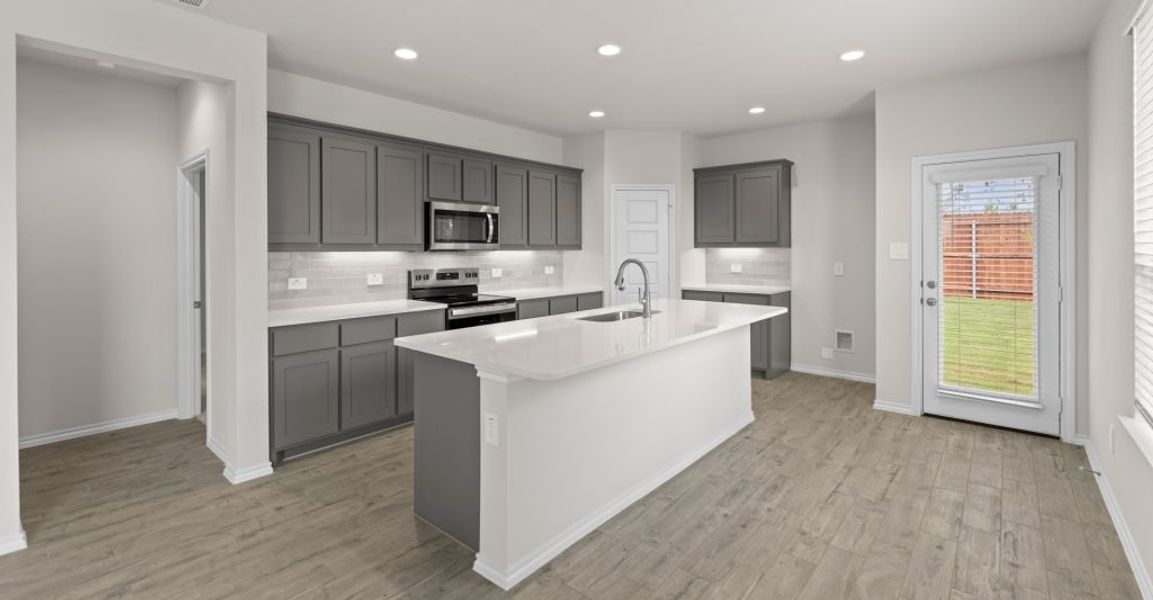 Representative exterior photo of a completed home built from the Willow by Impression Homes in Keeneland, Aubrey, TX (Image 5). Representative exterior photo of a completed home built from the Willow by Impression Homes in Keeneland, Aubrey, TX (Image 5).