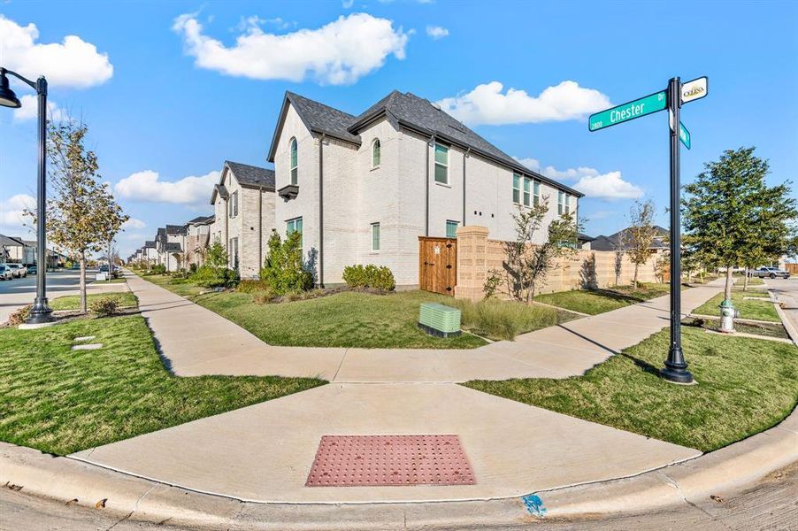 View of side of property featuring brick siding and a residential view