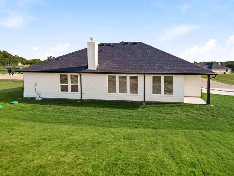 Exterior details and patio area of a home in Saddleback Estates, Boyd (Image 4).