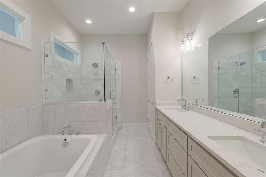 Relax and unwind in your stunning primary bathroom. Another view of the soaker tub and stand-up shower.