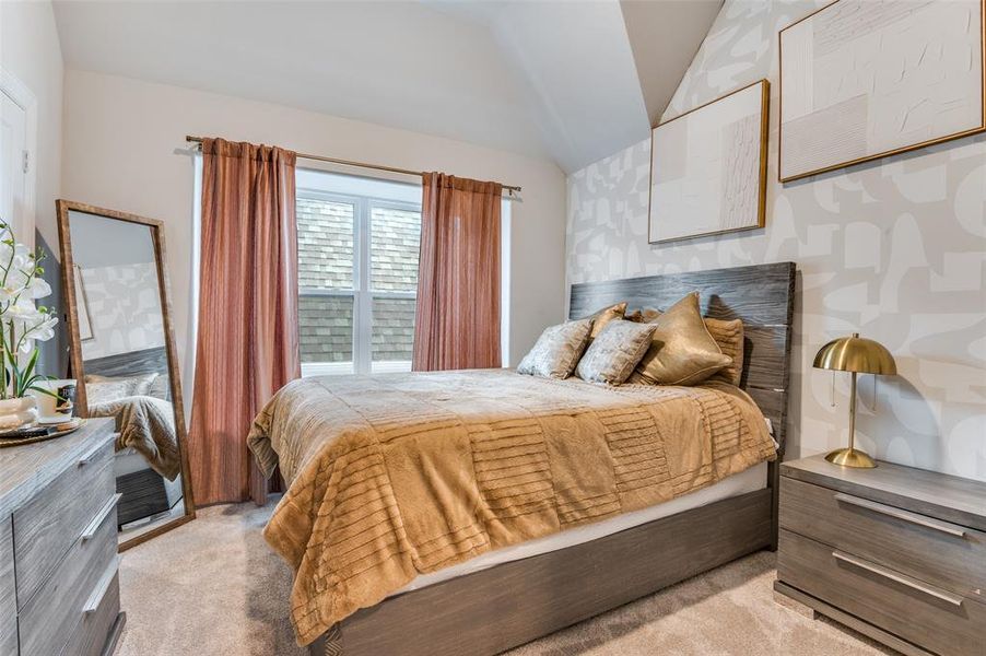 Bedroom with light carpet and vaulted ceiling