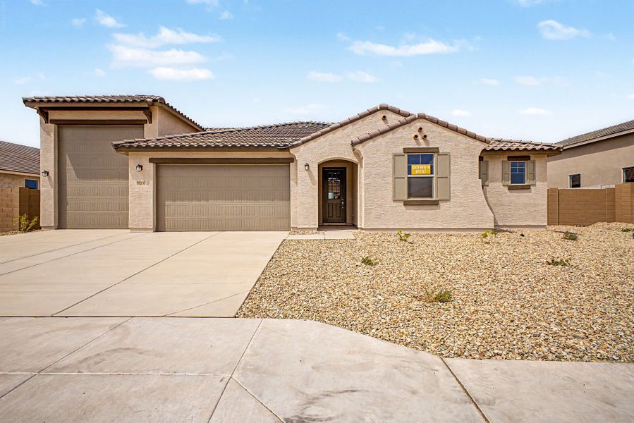 Front exterior of a new home in White Tank Vistas, Waddell, AZ, highlighting curb appeal (Image 1). Front exterior of a new home in White Tank Vistas, Waddell, AZ, highlighting curb appeal (Image 1).
