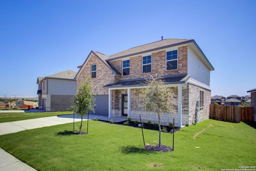 Front exterior of a new home in Comanche Ridge, San Antonio, TX, highlighting curb appeal (Image 40).