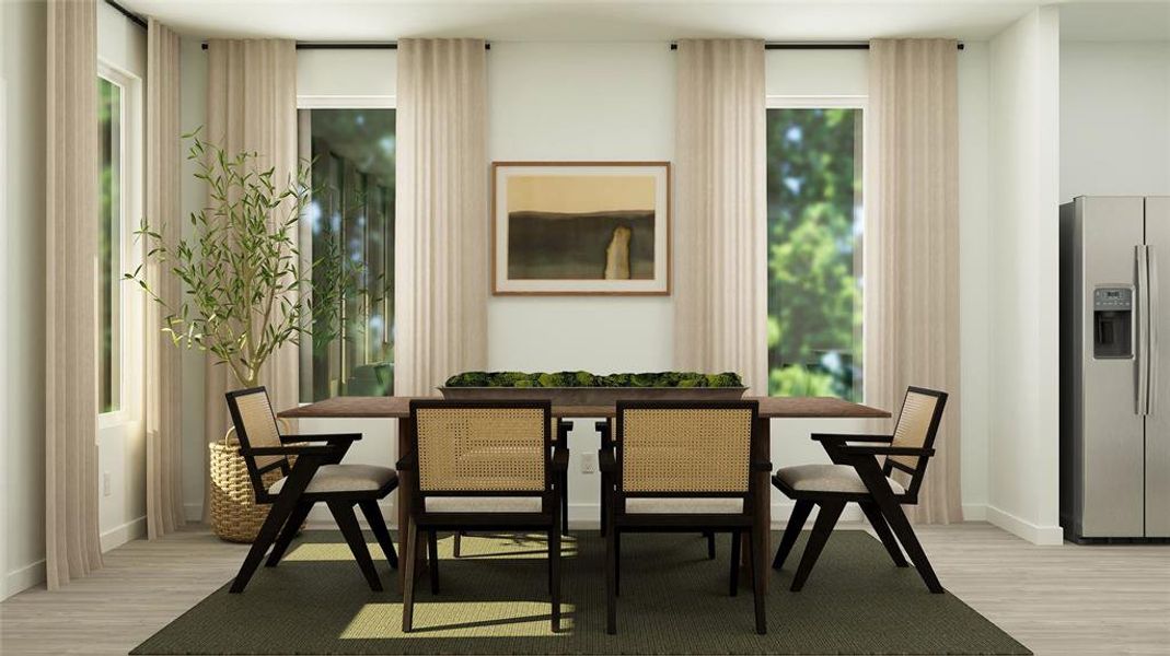 Dining area with light hardwood / wood-style floors