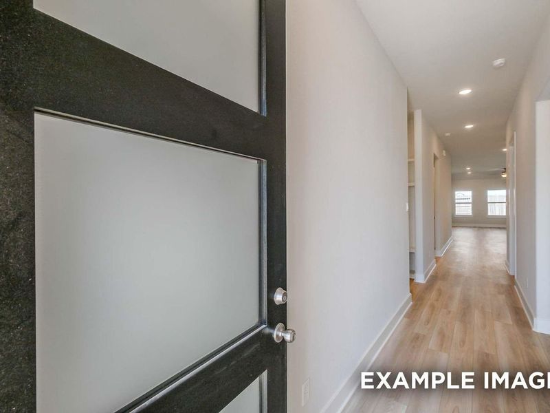 Spacious, unfurnished interior of a new home in Sunterra, Katy (Image 11).