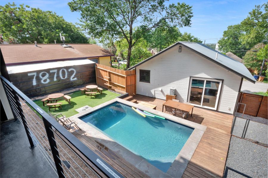View of swimming pool with a deck