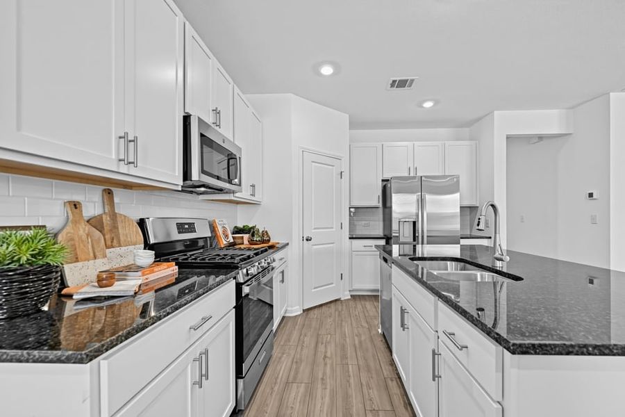 Representative furnished interior of a home built from the Grouse by Taylor Morrison in Emory Crossing, Hutto (Image 3).