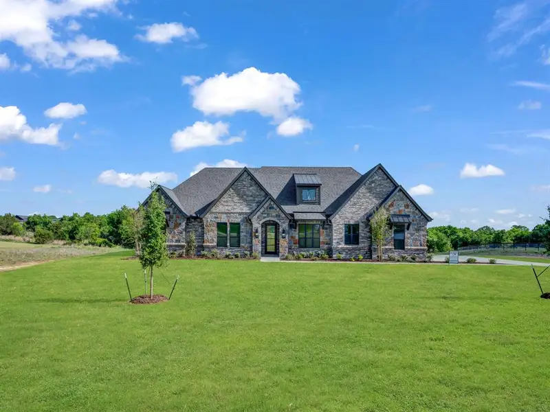 Front exterior of a new home in , Weatherford, TX, highlighting curb appeal (Image 26).