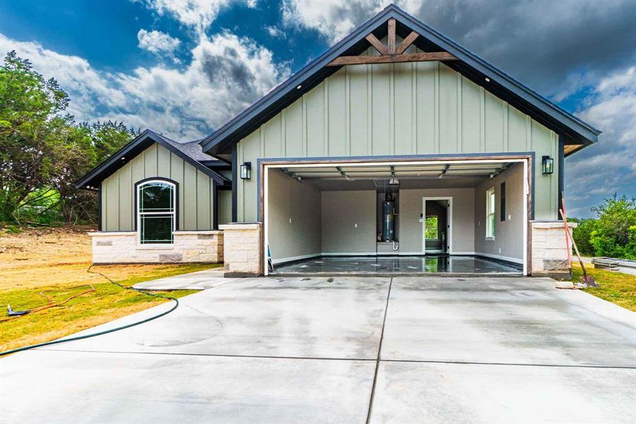 Front exterior of a new home in , Granbury, TX, highlighting curb appeal (Image 1). Front exterior of a new home in , Granbury, TX, highlighting curb appeal (Image 1).