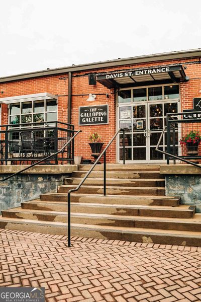 Front exterior of a new home in Rosewood Lake Estates, Hoschton, GA, highlighting curb appeal (Image 47).