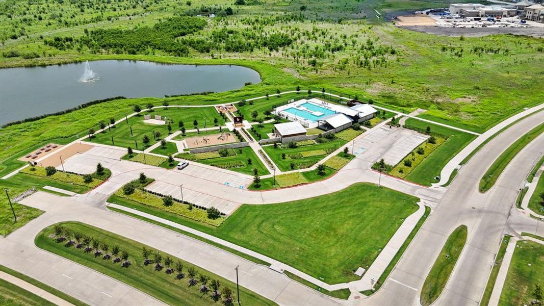 Community amenities feature a large recreational pool, extensive paved pathways, multiple playgrounds, and expansive green spaces Community amenities feature a large recreational pool, extensive paved pathways, multiple playgrounds, and expansive green spaces