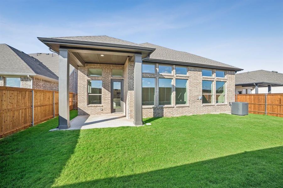 Exterior details and patio area of a home in Creekshaw – Classic, Royse City (Image 2).