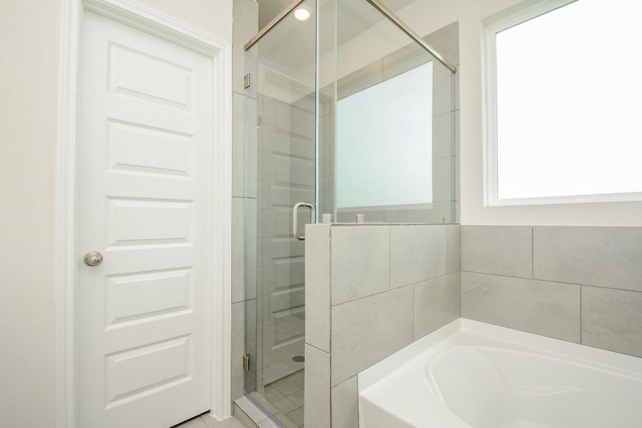 Notice the spa like features of this bathroom with a soaking tub and separate shower.