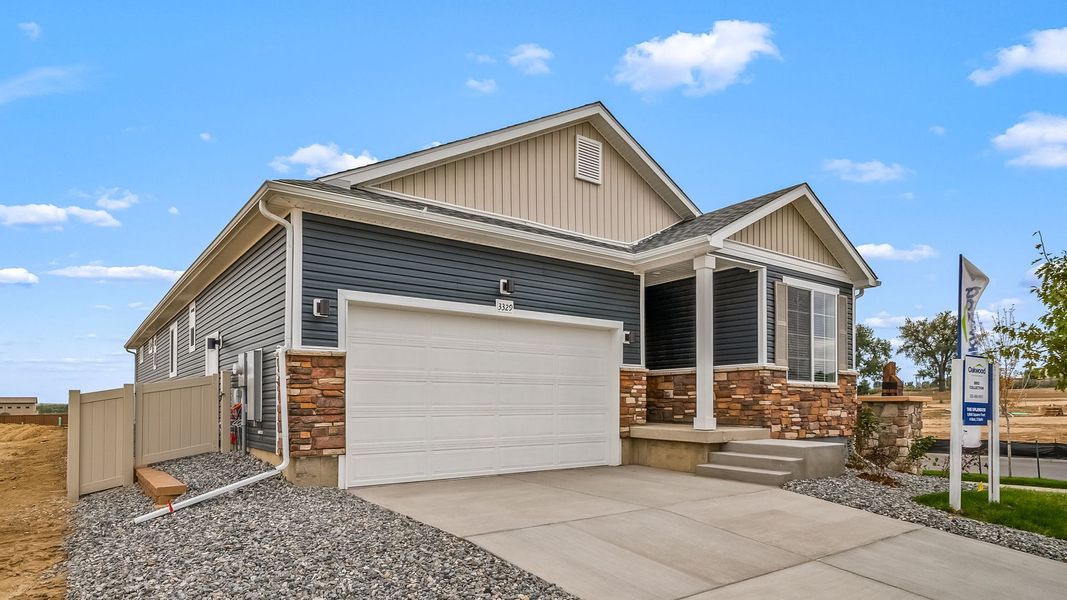 Front exterior of a new home in Thompson River Ranch, Johnstown, CO, highlighting curb appeal (Image 24).