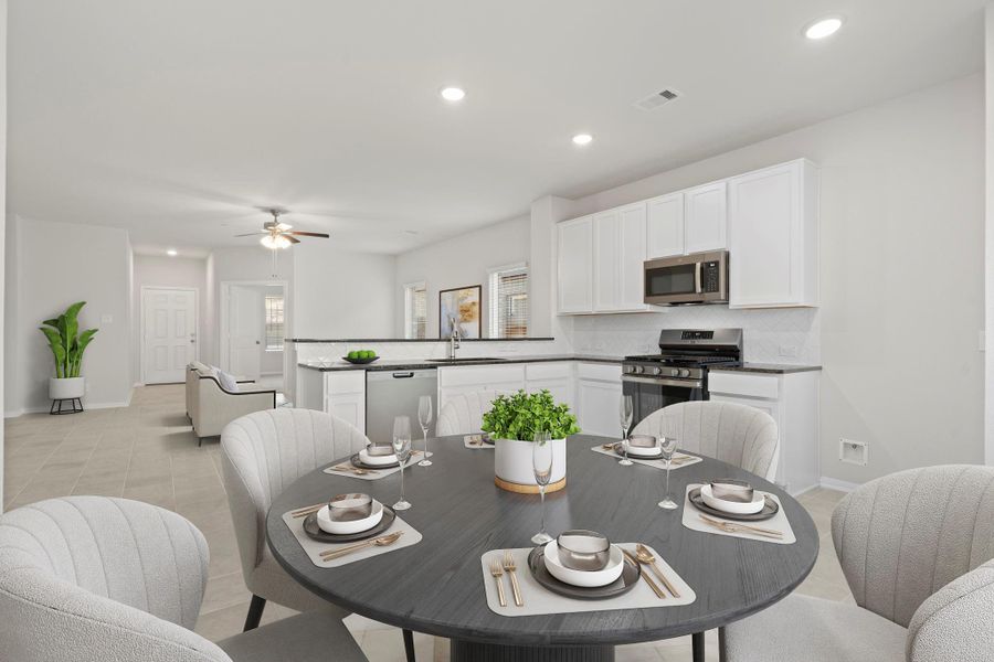 Virtually staged to highlight its spaciousness, the breakfast area feels bright and cheerful with natural light pouring in from the surrounding windows—ideal for both casual meals and morning coffee.