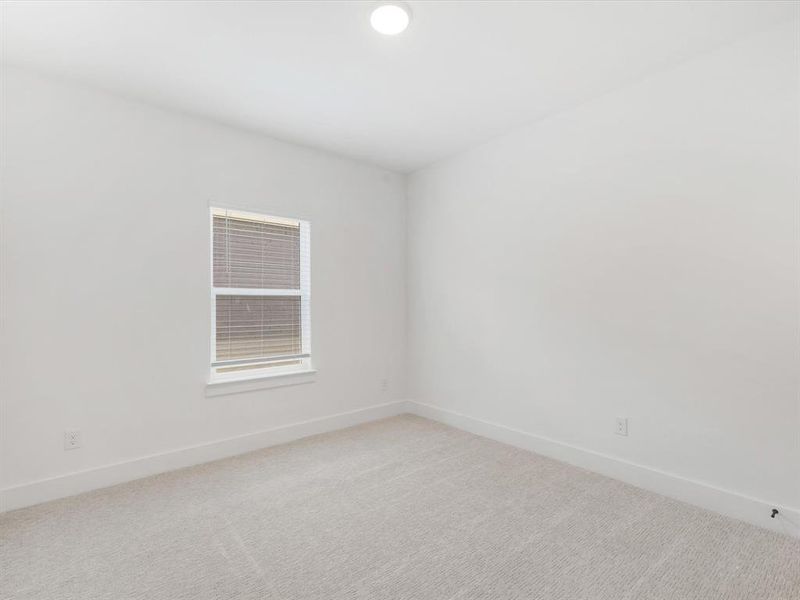 Spacious, unfurnished interior of a new home in Royal Court, Little Elm (Image 23).