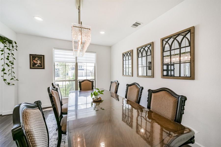 A spacious formal dining room, perfect for hosting large gatherings with ease and elegance. A spacious formal dining room, perfect for hosting large gatherings with ease and elegance.