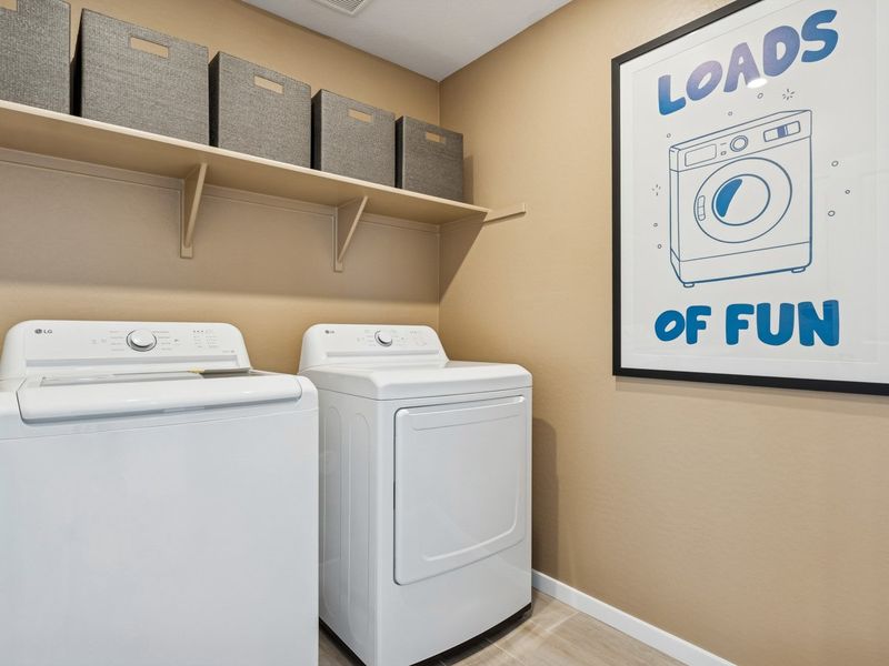 A washer and dryer in a room.