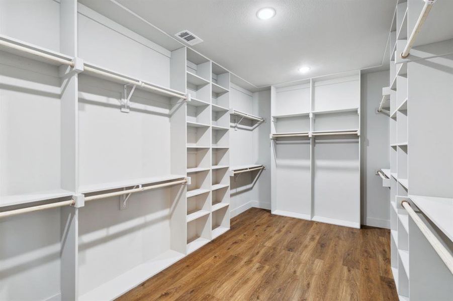 Walk in closet featuring wood-type flooring