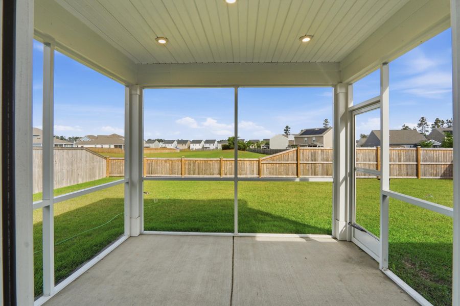 Exterior details and patio area of a home in Sanctuary Cove at Cane Bay, Summerville (Image 32).