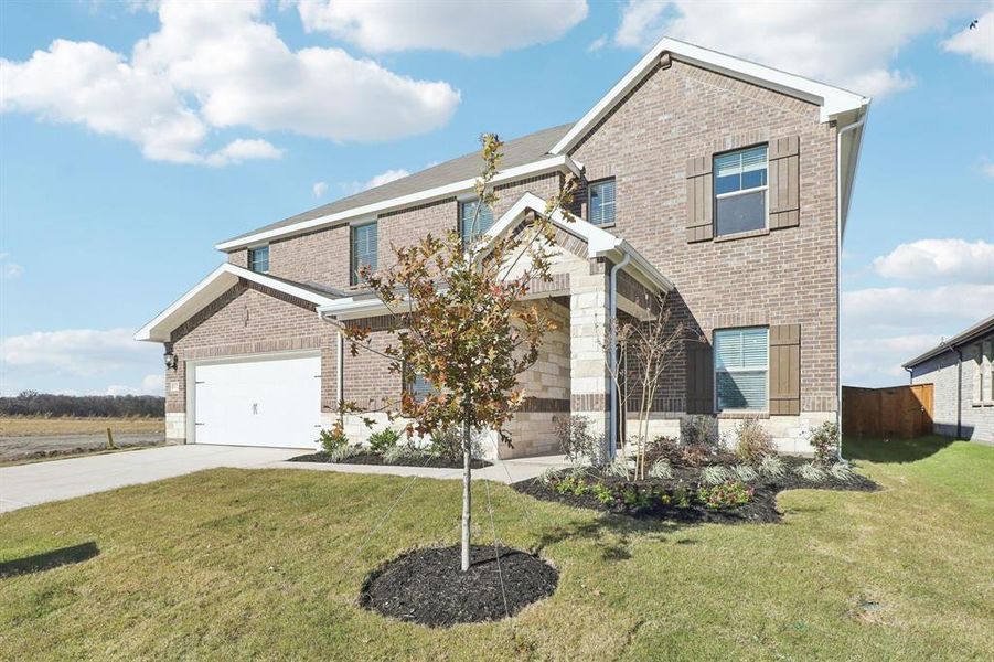 Front exterior of a new home in Lakehaven - Premier Series, Farmersville, TX, highlighting curb appeal (Image 20).