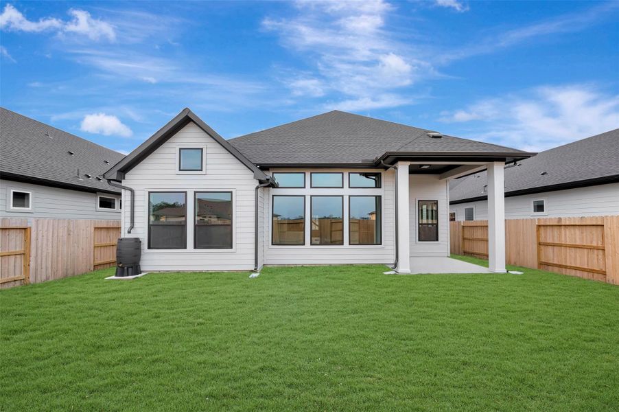 Exterior details and patio area of a home in ARTAVIA 50' Homesites, Conroe (Image 26).