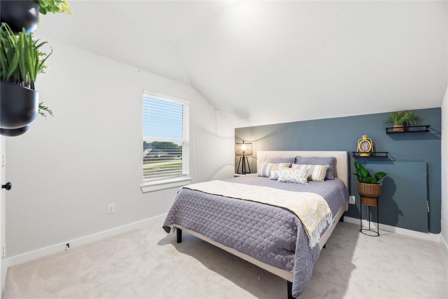 One of two secondary bedrooms upstairs