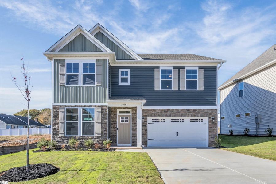Front exterior of a new home in Halton Oaks, Spartanburg, SC, highlighting curb appeal (Image 2).