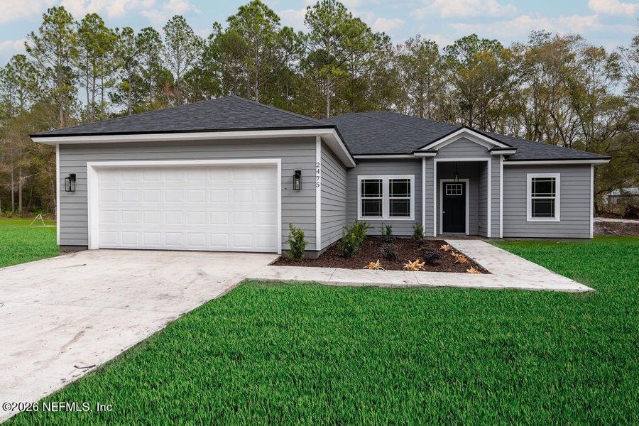 Front exterior of a new home in , Middleburg, FL, highlighting curb appeal (Image 16). Front exterior of a new home in , Middleburg, FL, highlighting curb appeal (Image 16).